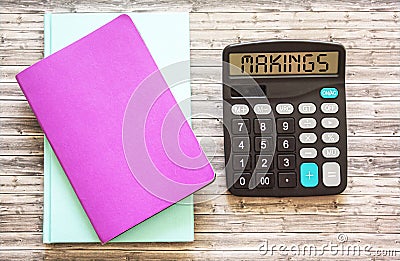 A calculator with the inscription makings and notebook Stock Photo