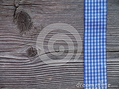 Wooden background with a checked ribbon Stock Photo