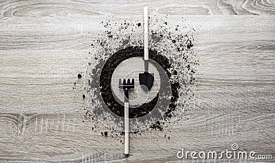 Wooden background concept earth piled circle disc rake fork spade knife spoon texture planting center spring Stock Photo