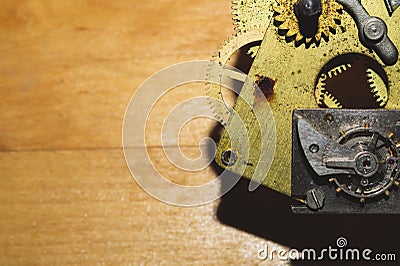 Wooden background with detail of clock mechanism. gears of a mechanical watch Stock Photo