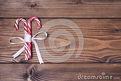 Wooden background with pair of Christmas candy canes Stock Photo