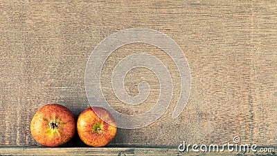 wooden background with two small apples Stock Photo