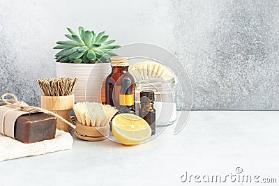 Wooden bamboo brushes, baking soda, lemon, essential oils, vinegar. Zero waste eco friendly cleaning concept. Copy space Stock Photo