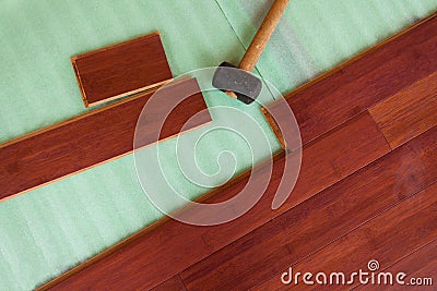 Wooden bamboo hardwood flooring planks being layed Stock Photo