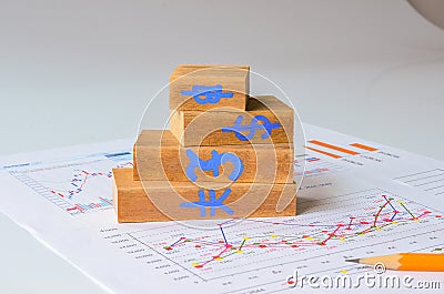 Wooden bar graph and pencil Stock Photo
