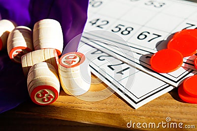 wooden barrels for playing lotto in a bag and tickets Stock Photo