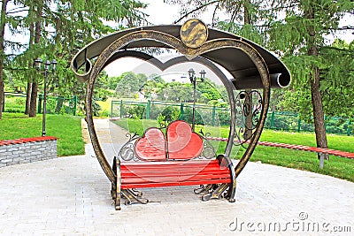 Wooden bench with back in the form of hearts Stock Photo