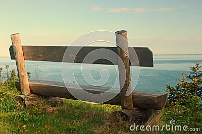 Wooden bench on cliff edge Stock Photo