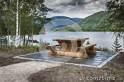 Wooden bench at fjord in norway Stock Photo