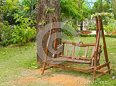 Wooden bench in the garden Stock Photo