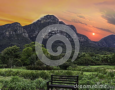 Wooden bench and table mountain in Kirstenbosch Botanical Garden Cape Town South Africa Stock Photo