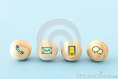 wooden bids with contact us icons. Stock Photo