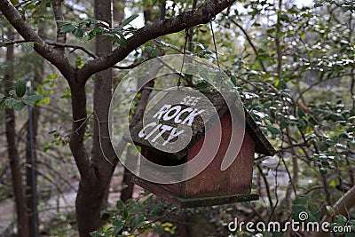 A wooden bird house with white inscription `See Rock City` Stock Photo