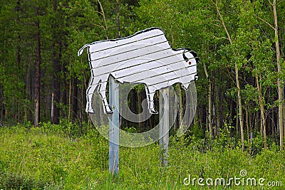 A wooden bison attention sign along the highway Stock Photo