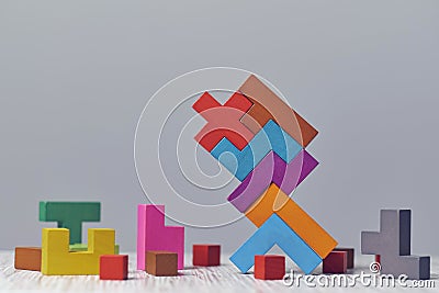 Wooden block puzzle. wood cube stacking. Concept of complex and smart logical thinking. Slightly defocused and close up Stock Photo