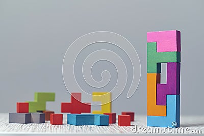 Wooden block puzzle. wood cube stacking. Concept of complex and smart logical thinking. Slightly defocused and close up Stock Photo