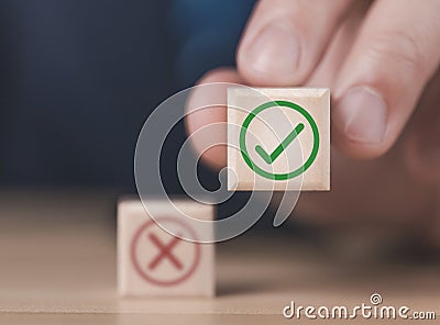 wooden block showing right and wrong sign decision concept, vote and think yes or no Business options for difficult situations Stock Photo