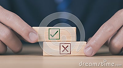 wooden block showing right and wrong sign decision concept, vote and think yes or no Business options for difficult situations Stock Photo