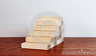 Wooden blocks as a staircase stacking. Career ladder concept for successful business development Stock Photo