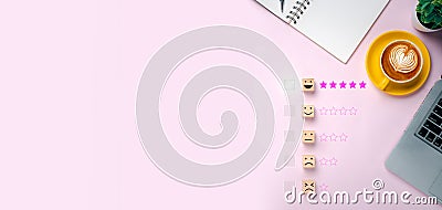 Wooden blocks with happy face smile face symbol symbol on pink backgrounds, good feedback rating and positive customer review Stock Photo