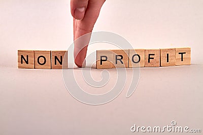 Wooden blocks with letters making non profit text. Stock Photo