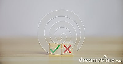 Wooden blocks show right and wrong signals, concepts, decisions, votes, and think yes or no. Business options for difficult Stock Photo