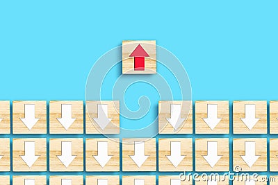 Wooden blocks with white and red arrows. Different directions. Leadership success concept. Innovative solution. Individual concept Stock Photo