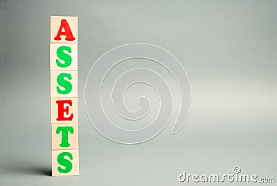 Wooden blocks with the word Assets. Resource owned by the business. Financial accounting. Money and finance. Cash equivalents, Stock Photo