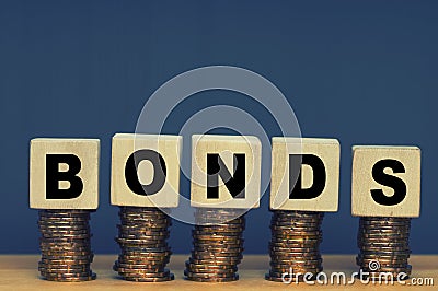 Wooden blocks with the word Bonds. Equivalent loan Stock Photo