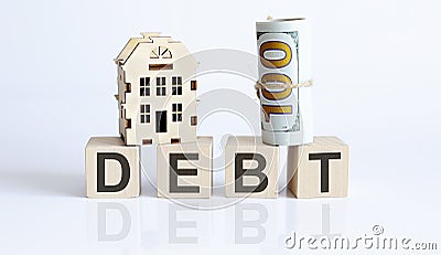 Wooden blocks with the word For DEBT Real estate concept. Rent apartment. Property Stock Photo