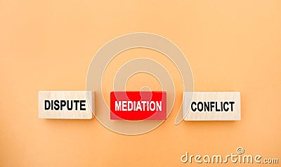 Wooden blocks with the word dispute, mediation, conflict. Settlement of disputes by mediation. Dispute Resolution. Third party, Stock Photo