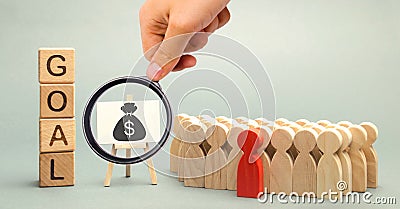 Wooden blocks with the word Goal, money and business team. Business concept. Cooperation and teamwork. Improving the efficiency of Stock Photo