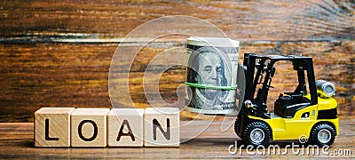 Wooden blocks with the word Loan and forklift. Credit provided by the lender to the borrower at a certain interest for the use of Stock Photo