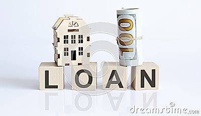 Wooden blocks with the word For LOAN Real estate concept. Rent apartment Stock Photo