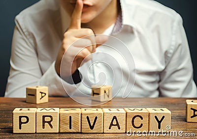 Wooden blocks with the word Privacy and businessman. Keeping secret information about a personâ€™s personality or activity and Stock Photo