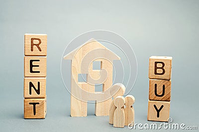 Wooden blocks with the word Rent or buy and a family stands near the house. Make the right decision. Real estate concept. Rent Stock Photo