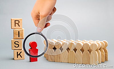 Wooden blocks with the word Risk and a team with a leader. Business concept of teamwork, crisis solution and problem management. Stock Photo