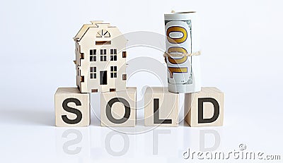 Wooden blocks with the word For SOLD Real estate concept. Rent apartment Stock Photo