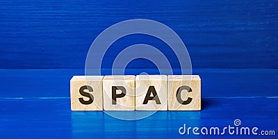 Wooden blocks with the word SPAC - Special purpose acquisition company. Simplified listing of company, merger bypassing stock Stock Photo