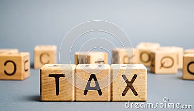 Wooden blocks with the word Tax. Business and finance concept. Taxes and taxation. The tax burden Stock Photo