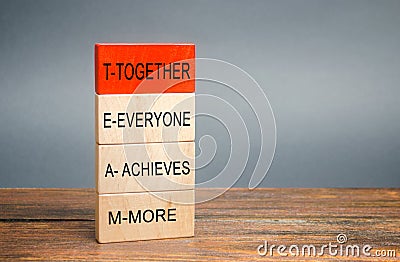 Wooden blocks with the word Together, Everyone, Achieves, More. Teamwork and team concept. Community, support, partnership. Stock Photo