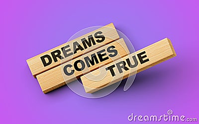 Wooden blocks with the words Dreams Come True. 3d illustration Stock Photo