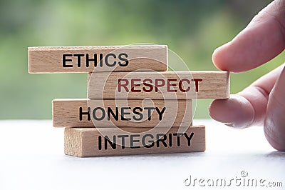 Wooden blocks with words Ethics, Respect, Honesty and Integrity. Business culture and code of conduct Stock Photo