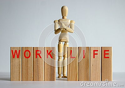 Wooden blocks with words `work life`. Wooden model of human Stock Photo