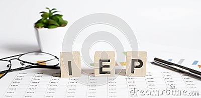 Wooden blocks written with IEP stands for Individualized Educational Program Stock Photo
