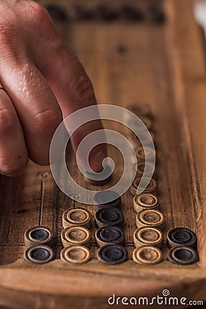 Wooden Board with backgammon, pawns, dice, close up Stock Photo