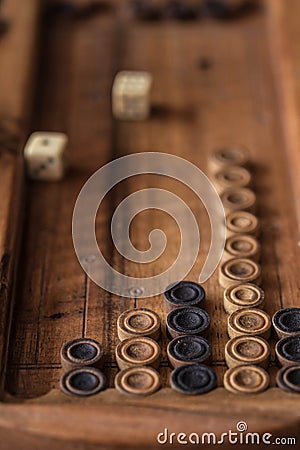 Wooden Board with backgammon, pawns, dice, close up Stock Photo