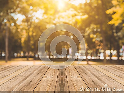 Wooden board empty table in front of blurred background. Perspective brown wood table over blur trees in forest background Stock Photo