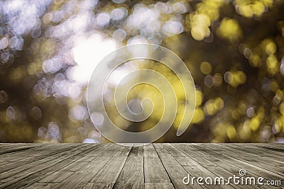 Wooden board empty table in front of natural blurred background. Perspective brown wood over bokeh of tree Stock Photo