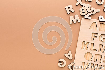 Wooden board with English alphabet letters Stock Photo